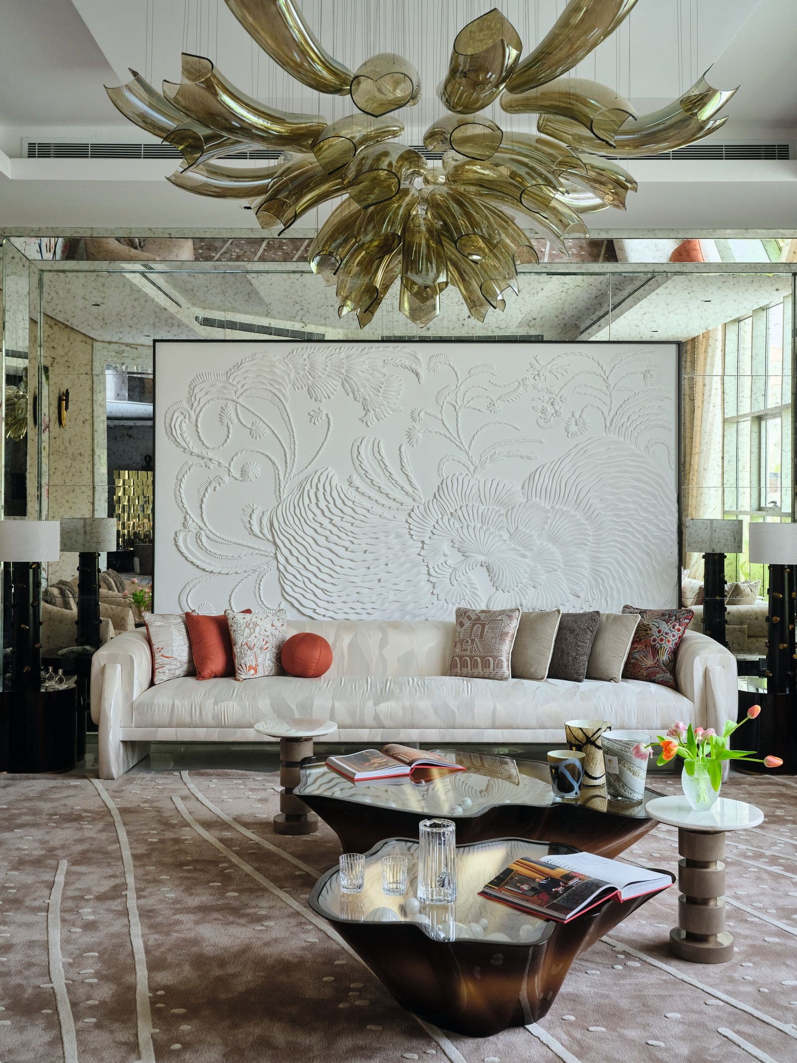 Ivory velvet seating with golden glass chandelier